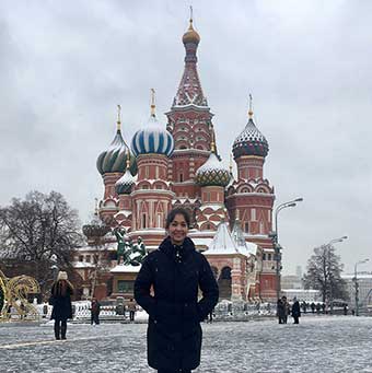 jennifer ginsburg poses in front of russian building