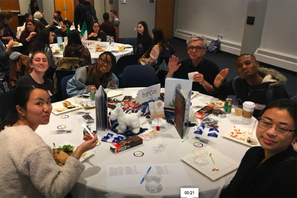 french language speakers gathered around lunch table