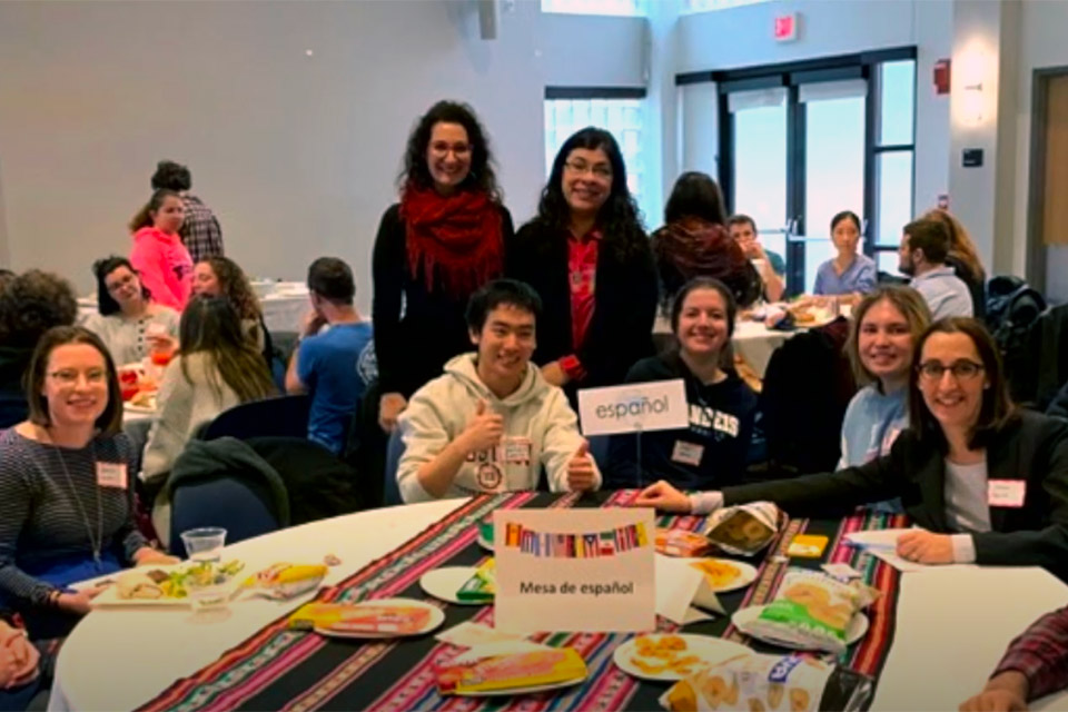 spanish language students and faculty gathered around lunch table