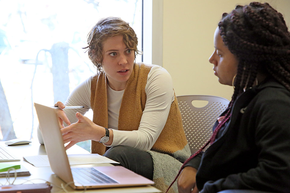 Two people working together at the Writing Center