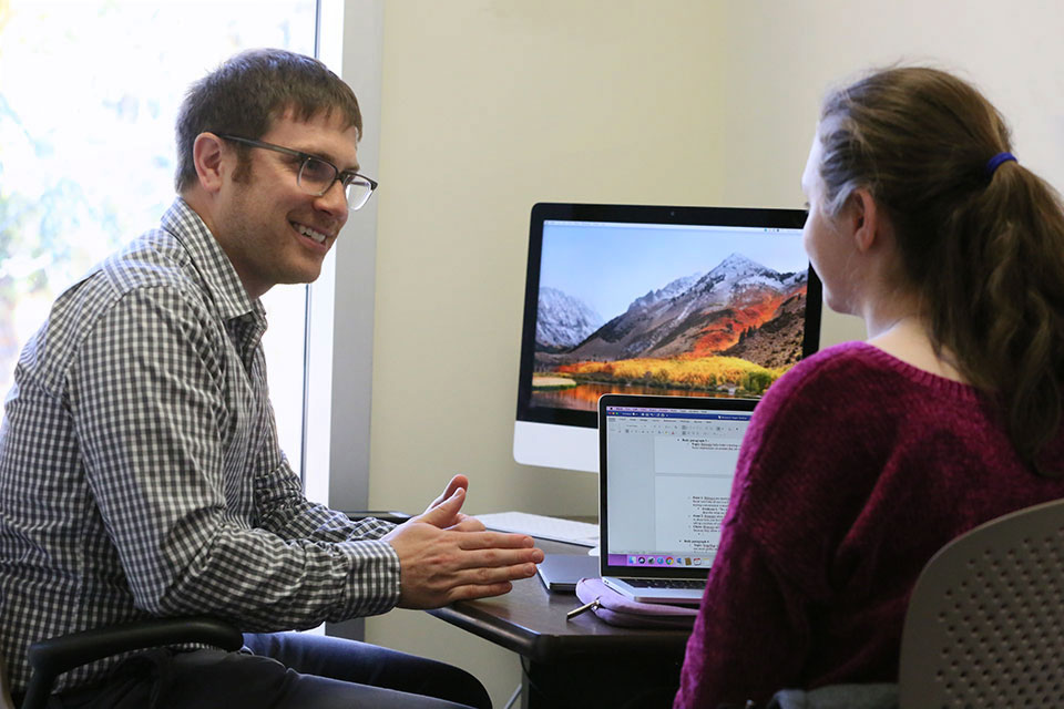 A student receiving one-on-one support in the writing center