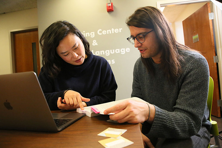 A student with Bofang Li in the writing center