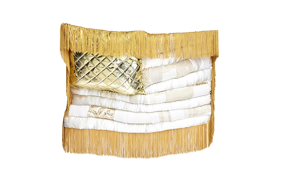 white and gold puffy flag with gold fringe on the top, like bangs