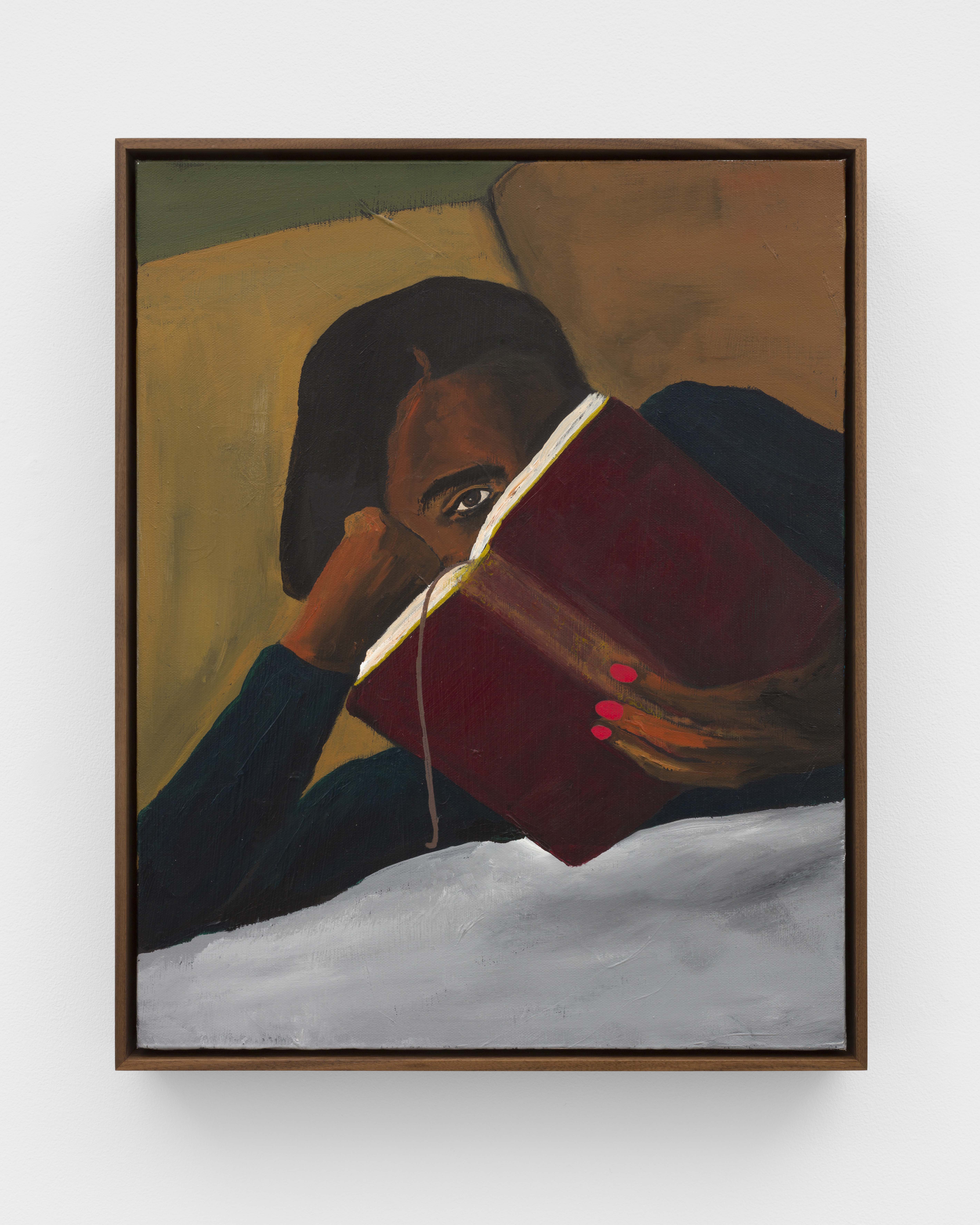 A woman reclined and reading with her face partially obscured by a book. 