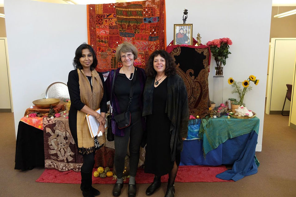 Three scholars at a celebration