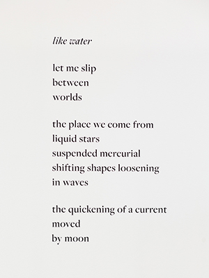 installation view Jaime Black exhibition, a poem in black letters on a white wall, titled, "like water"