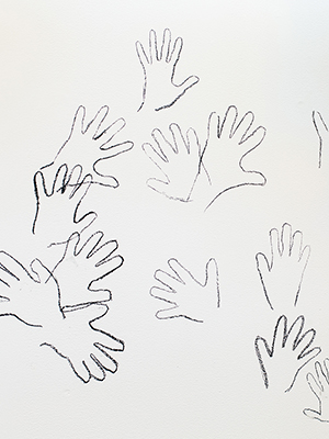 installation view Jaime Black exhibition, hand prints on the wall, traced with charcoal