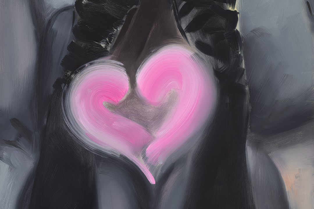 view of woman's shins, feet pointed upward, fluorescent pink heart appearing in between her ankles