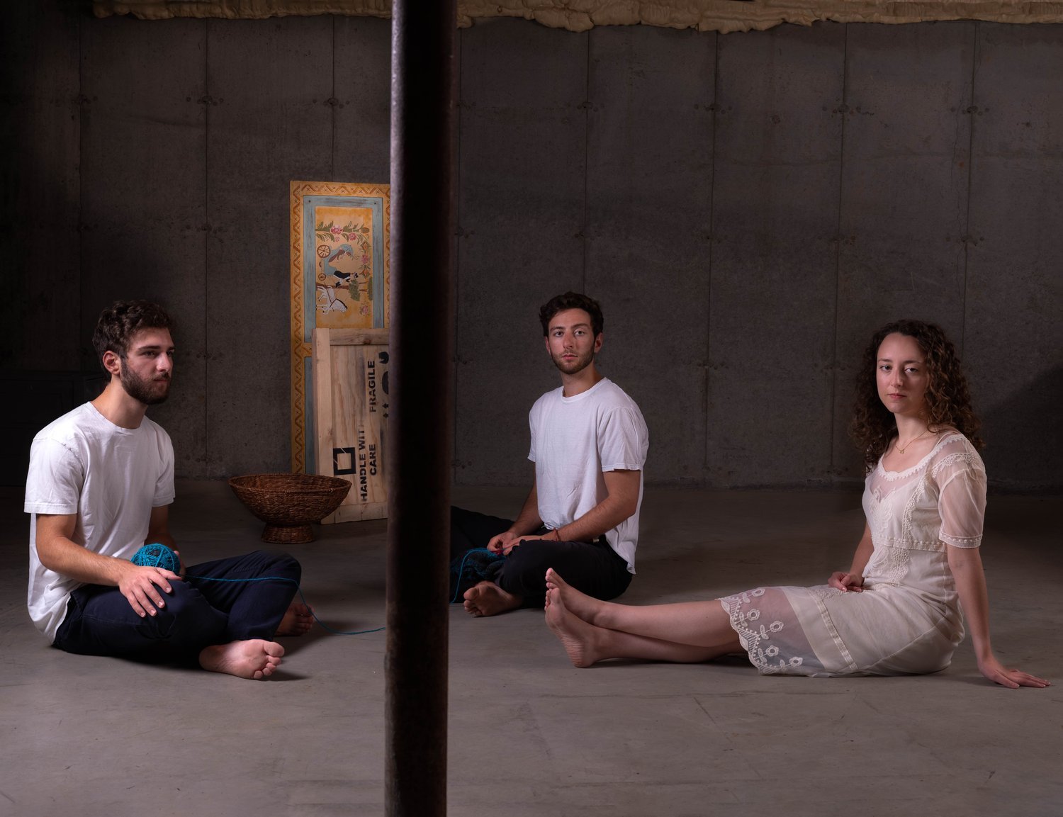 Three people sitting on the floor