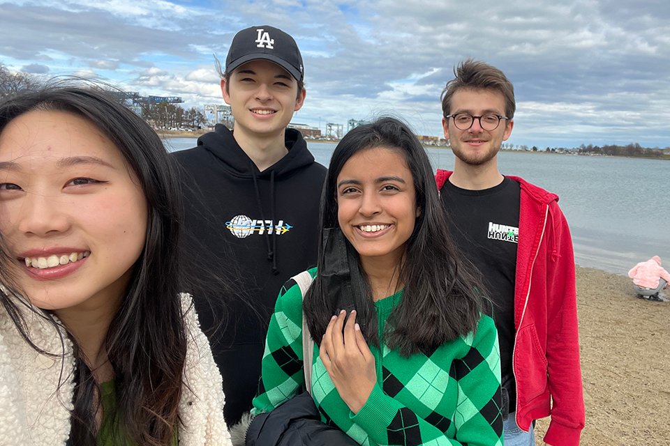 Exchange students standing on a beach overlooking the Atlantic Ocean