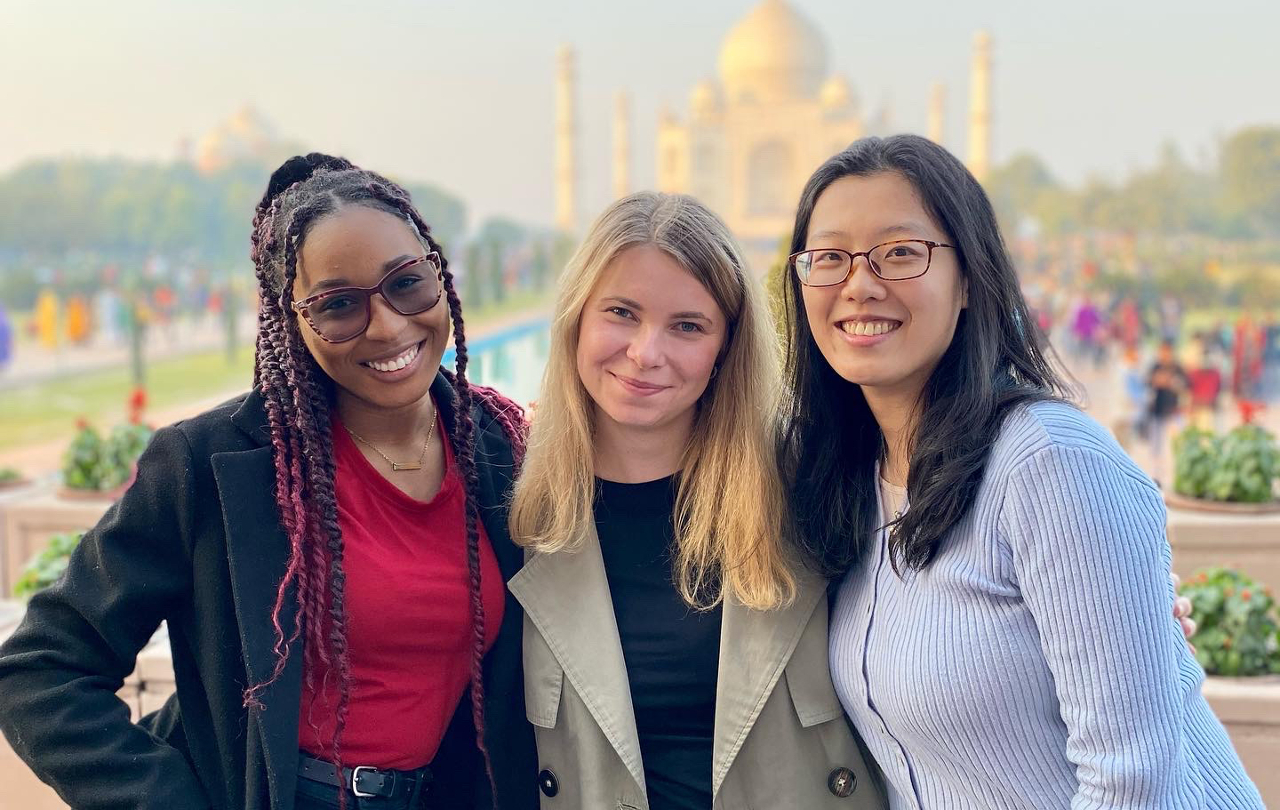 Djounia Saint-Fleurant and two other students pose with the Taj Mahal in the background.