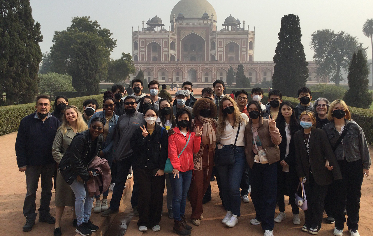 Djounia Saint-Fleurant and two other students pose with the Taj Mahal in the background.