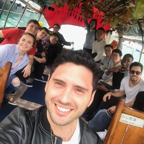 Hassenfeld fellow Tal Richtman, BA/MA’20, and classmates aboard a sampan boat cruise in Hong Kong’s Aberdeen fishing village.
