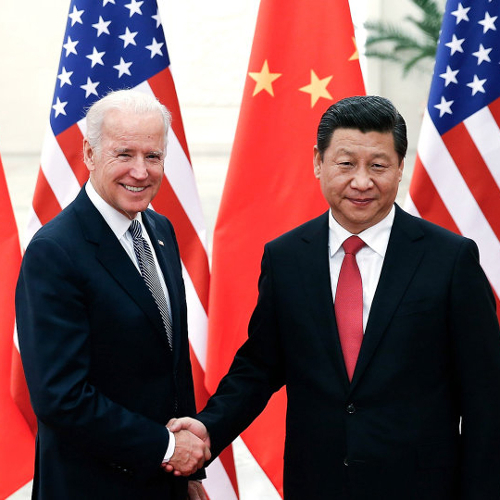 Then Vice Presiden Joe Biden shakes hands with Chinese Premier Xi Jinping.