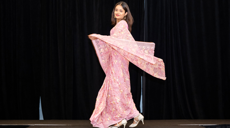 A student in a pink Indian dress.