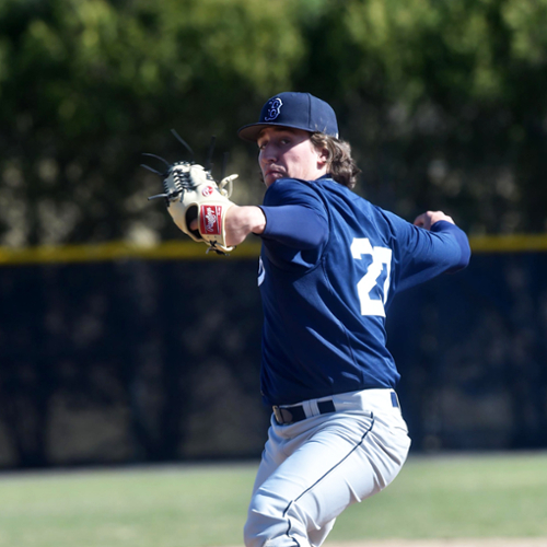 Gavin Dauer winds up to throw a pitch during a Brandeis baseball game.