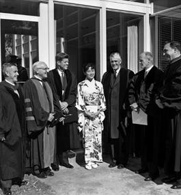 Wakako Hironaka stands with John F. Kennedy and a group of other men