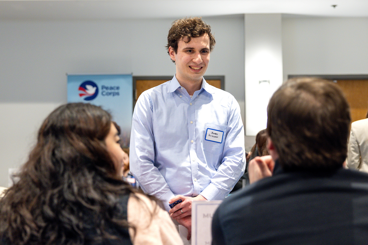 Students chat with an employer during the 2022 Government & Public Service Career Fair