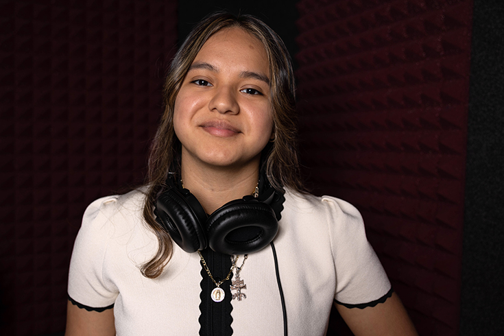 Portrait of Liz Sandoval, ’25, inside the Sound Studio at Brandeis University on April 17, 2023. Photo/Gaelen Morse