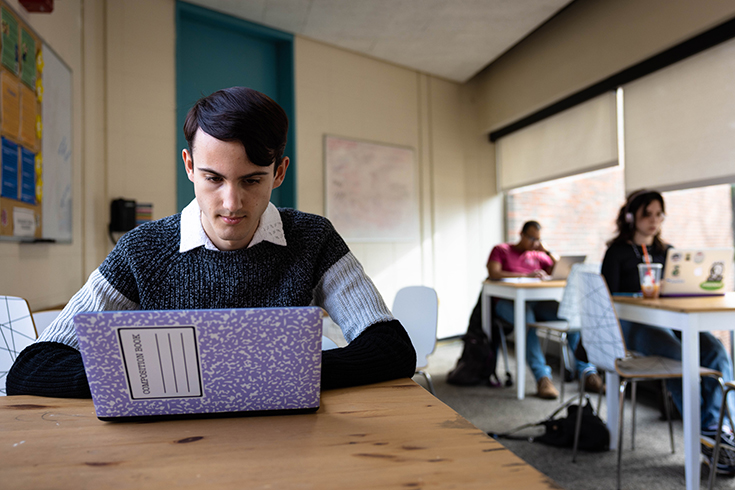 Cameron Samuels '26 works in s study space in Usdan at Brandeis University on January 18, 2023. Photo/Dan Holmes