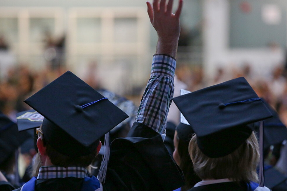 students with caps and gowns