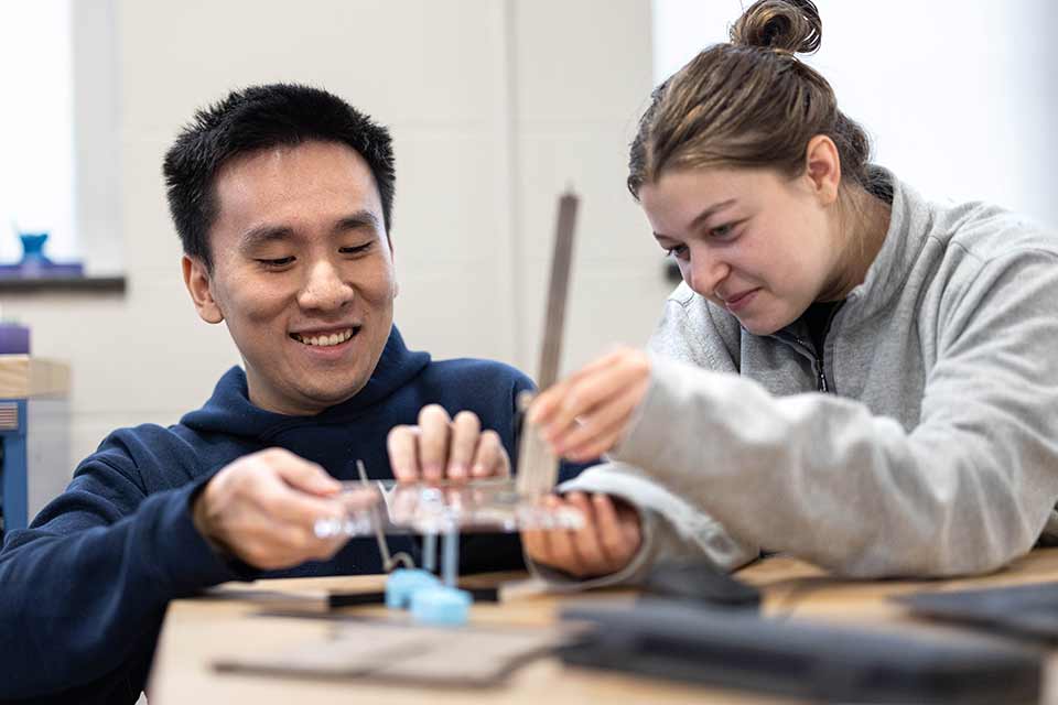Two people working together in a science lab