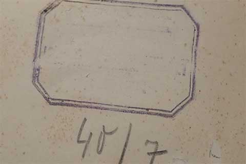 Outline of a scratched-out stamp.