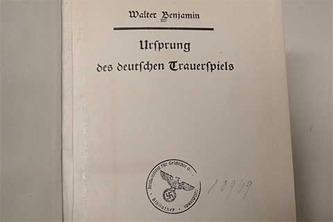 Title page of a book stamped with the Nazi eagle.