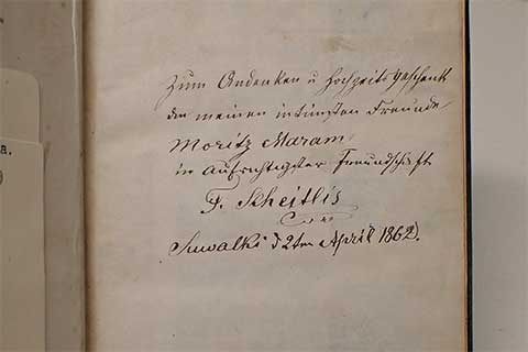 Flyleaf of a book with a round stamp from the Offenbach Archival Depot.