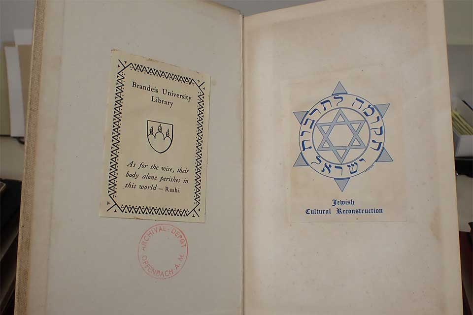 Inside cover and title page with Brandeis library bookplate and Offenbach stamp.