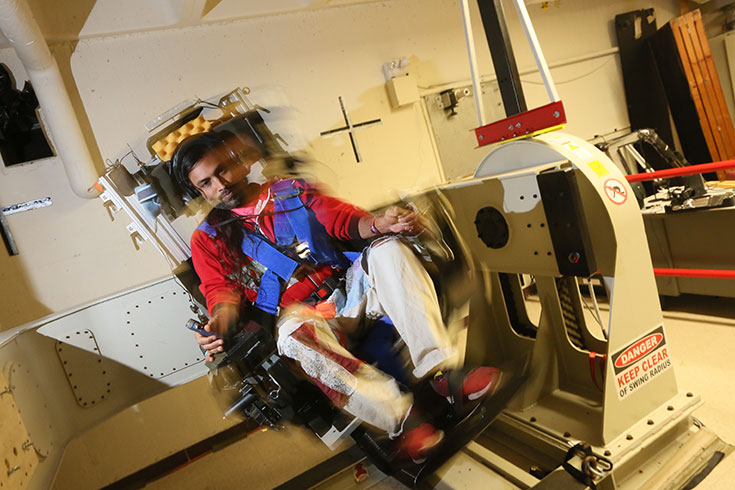 A person sits in a spinning chair